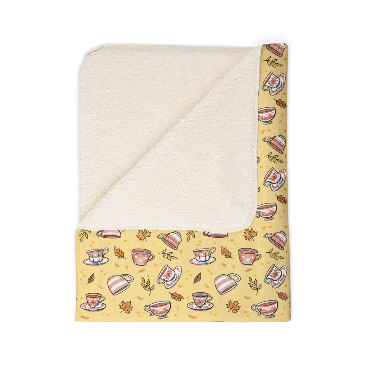 Hand drawn autumn teacups design on a pale yellow fleece blanket - fleece texture detail